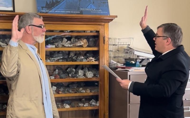 San Juan County Sheriff Bruce Conrad swearing in January 2023 for his second elected term by former San Juan County Judge Anthony Edwards photo by DeAnne Gallegos
