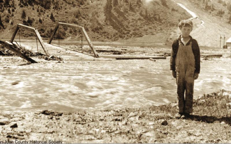 ABOVE: The Animas River Bridge on 14th Street in June 1921 after being washed out in high water, with Donald Clifford on the bank. BELOW: The Animas River bridge at Howardsville, washed out by 1921 spring high water. Taken looking easterly from the west bank. One of the structures in the rear may be the old cabin of George Howard. San Juan County Historical Society photos