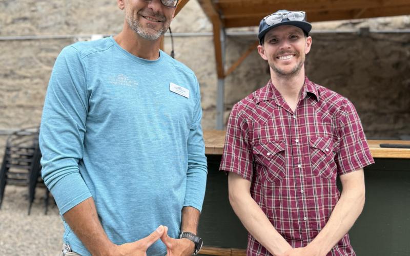 SMPA’s Paul Hora and Silverton local Jake Kurzweil, who is the SMPA elected board member for San Juan County, join EcoAction Partners at the farmers market to discuss Green Grants available. Photo credit DeAnne Gallegos