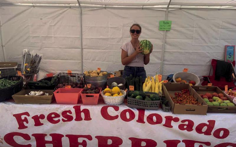 Raelen Barr sells fresh produce at the Columbine Roadhouse M-F, 10-6pm Photo by Raelen Barr