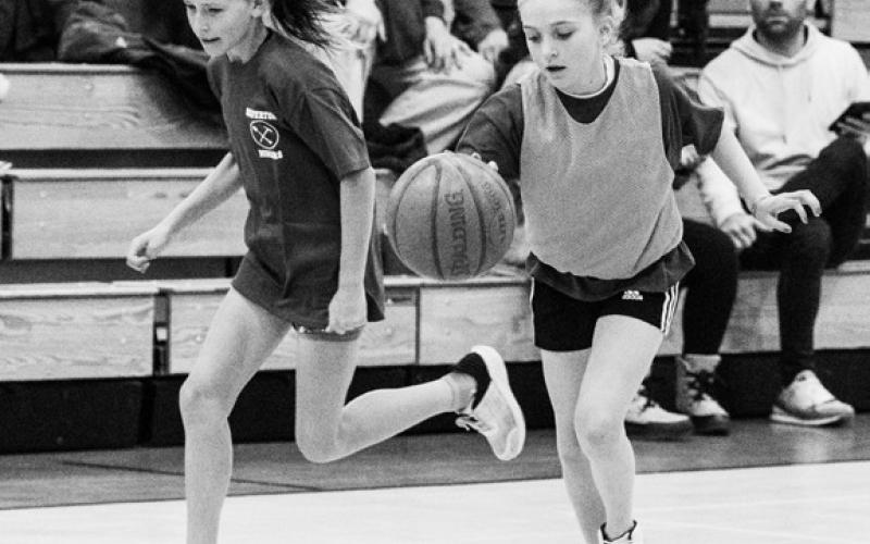 Photo credit Dave Emory Photo credit Dave Emory Lily Rodriguez takes the ball down the court, followed by Maya Foster. Ella Anderson eyes the basket for a middle school point.