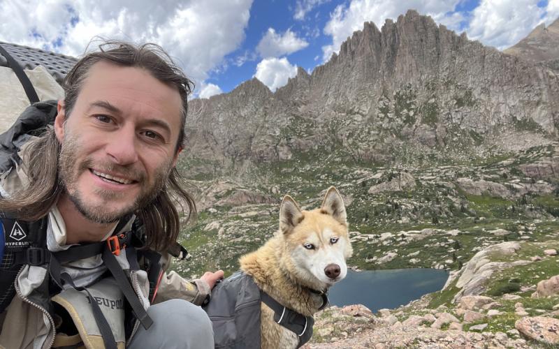 Brady Snow and is Dog Katana on Jagged Mountain in the Needle Mountains. Photo by Brady Snow