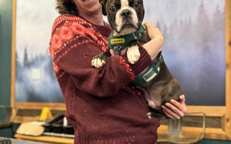photo by DeAnne Gallegos Gina Rosato of Timberline Trading and her shop dog DOC