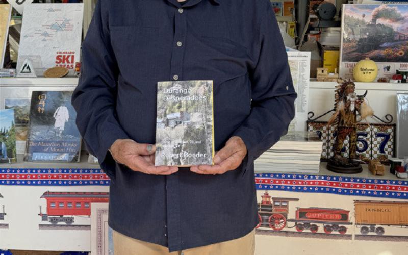 Author Robert Boeder showing his new book Photo by Robert Boeder