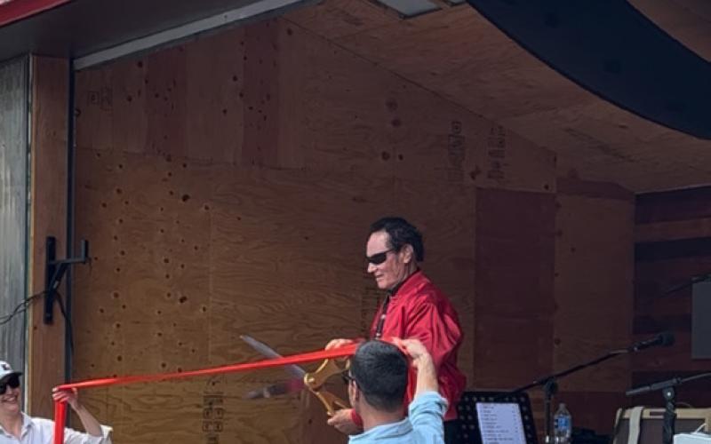 Mike Geryak cutting the ribbon on the opening of the stage and Anesi Park September 9, 2023 Photo by DeAnne Gallegos