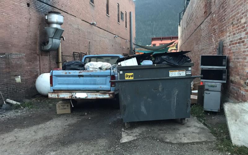 Unsecured dumpster and exposed trash in the back of a pickup outside Handlebar’s restaurant after the tragic accident. Photo credit Silverton Standard Staff