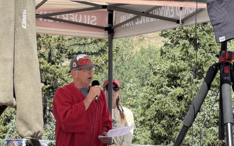 Dale Garland, the race director for Hardrock 100, emceeing the awards ceremony in Memorial Park on Sunday photo by DeAnne Gallegos