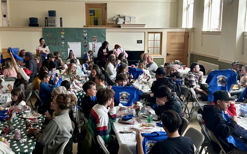 Students receive their school T -shirts at school holiday luncheon photo by Dr. Yvonne Naughton