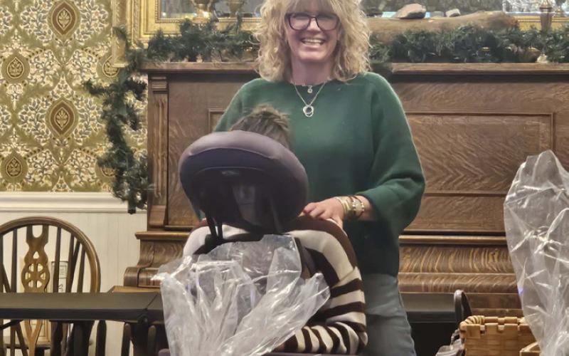 Local massage therapist Cara Pellowski had a massage chair at the event photo by Haley Jones
