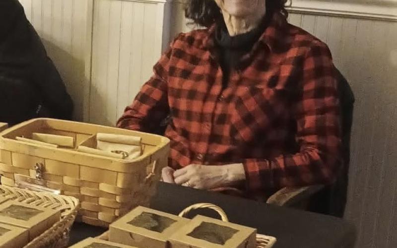 Deborah Roberts sells fresh-baked goods at the Christmas Bazaar photo by Keri Metzler