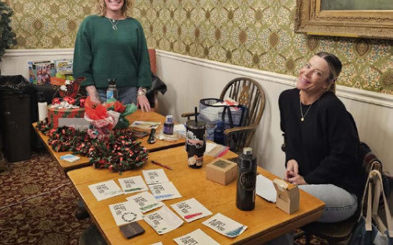 Cara Pellowski LMT a local massage therapist and Jamilynn Kaiser who is a local hair stylist sell gift certificates photo by Haley Jones