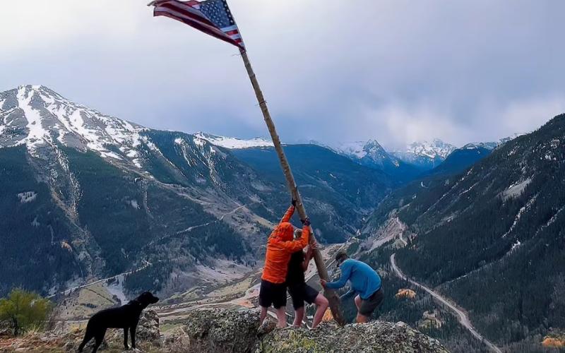  Thomas Moore On Memorial Day three locals Thomas Moore, Reid Kalmus, and Joe Lindberg put the flag and tree pole back up on Anvil Mountain overlooking Silverton.