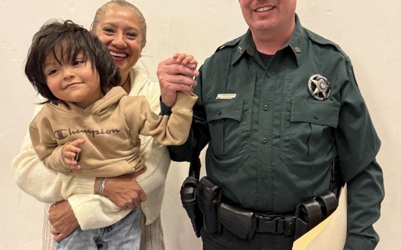 San Juan County Sheriff Steve Lowance, his wife Norma, and their son at the graduation ceremony photo by DeAnne Gallegos