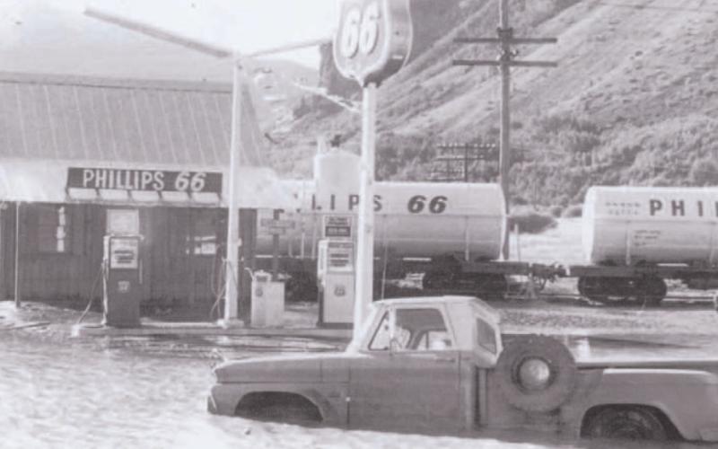 The Phillips 66 station at the wye is pictured during the flood of September 1970. Standing on the back of the truck is Jim Melcher. Photo courtesy of San Juan County Historical Society