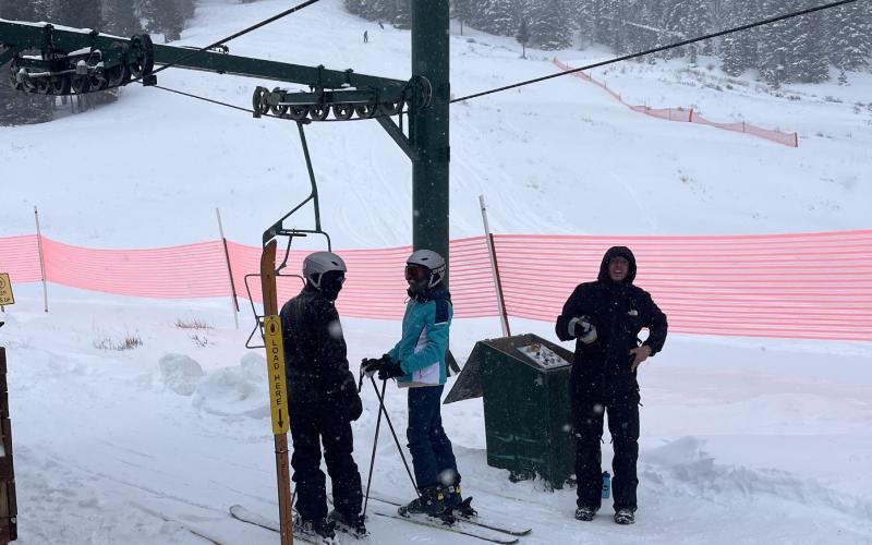 Skiers catching a ride on the lift Photo by Scott Fetchenhier