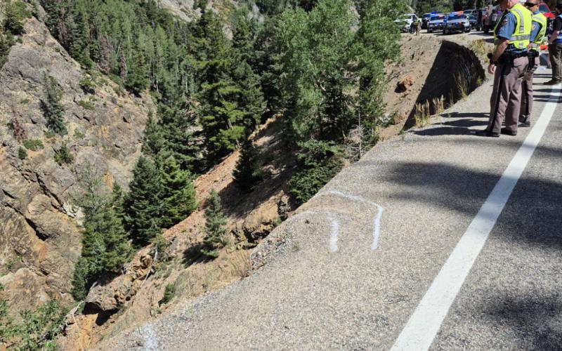 Aug 5th fatal accident photo shows CSP chalk lines of tires going over edge while trying to turn around on highway 550. Photo by CSP