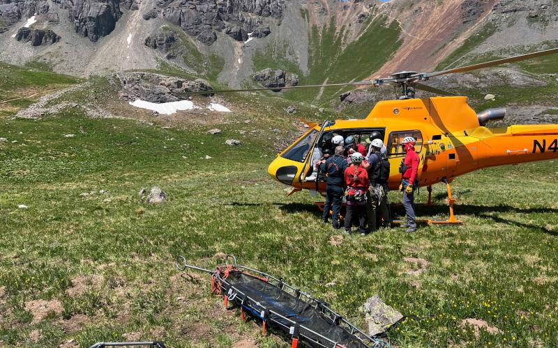 SMR team members load patient into the Flight for Life helicopter. Photo credit SMR Team