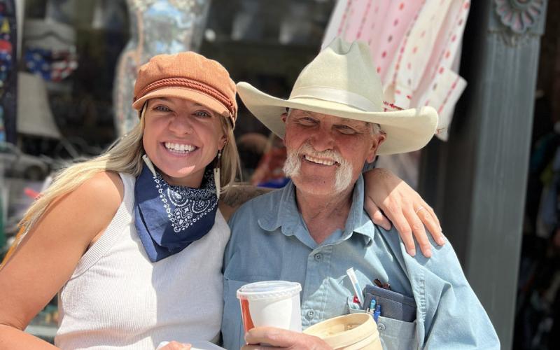 Coffee Bear and Nomad owner Holly Huebner takes a Highnoon Hamburger lunch break thanks to her buddy longtime local Tommy Wipf of Old Town Square. Photo credit DeAnne Gallegos