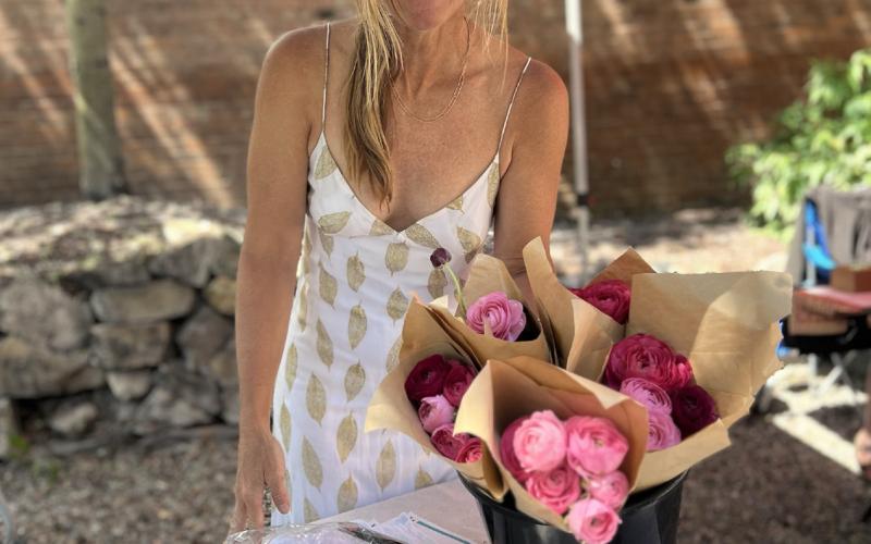 Kimmy Grant with the Silverton Farmers Market has weekly flower bouquets available. The Farmers Market is now Fridays in the Wyman Courtyard . Photo credit DeAnne Gallegos