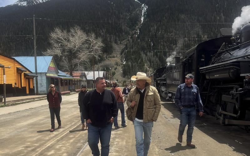 Celebrity Kevin Costner and local Jim Harper in front of the train.