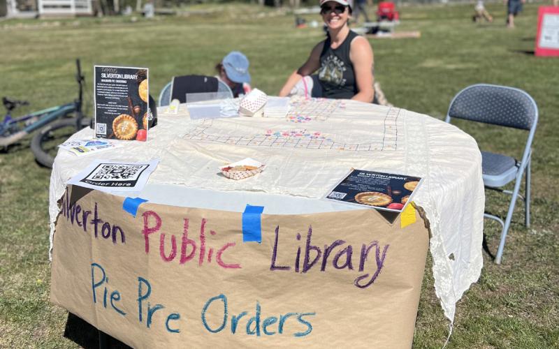 The Silverton Public Library gave out rhubarb pie samples in Memorial Park during Ironhorse and to boost 4th of July pie pre-sales with Silverton local Kim Medved taking orders. Photo credit DeAnne Gallegos