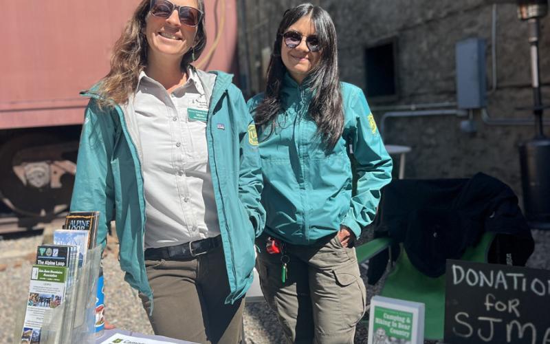 Silverton locals Myste French and Adela Pizarro-Conte work for the San Juan Mountains Association and had an information table at the Silverton Farmers Market. Photo credit DeAnne Gallegos