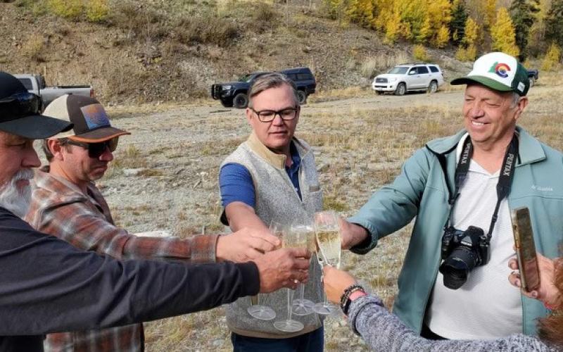 Champagne cheers over the land the County gained from Sunnyside Gold (L-R)- SJC Commissioners Pete Maisel, Chairman Austin Lashley, Anthony Edwards, SJC Administrator Willy Tookey, SJC PIO DeAnne Gallegos. Photo credit Jim Harper