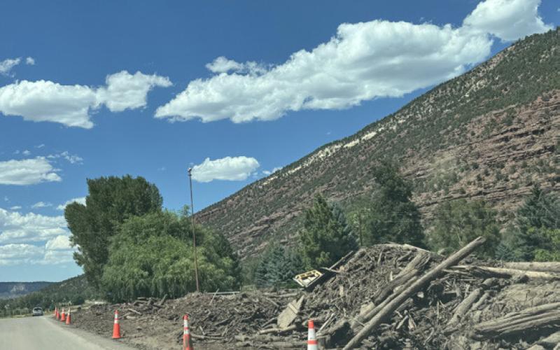 The aftermath- a wall of debris along Highway 550 between Ouray and Ridgway Photo by Katey Fetch