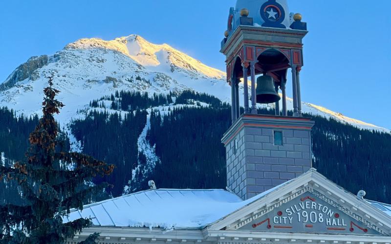 Town Hall at sunset Monday evening had a clear blue sky above it. Below zero frigid temps settled in that night. Photo credit DeAnne Gallegos