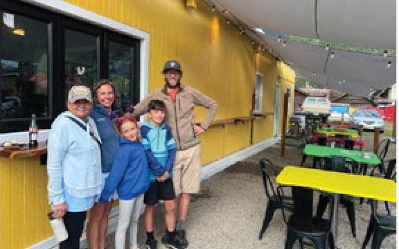 The Brosh Family show the new outdoor patio of the Dera Deli. Photo credit DeAnne Gallegos