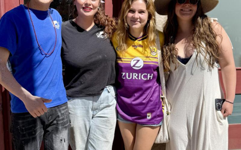 Before the 4th of July parade started, friends Alex Torres, Natalie Streeter, Feline Brown and Maya Leone enjoyed the crowd scene together photo by DeAnne Gallegos