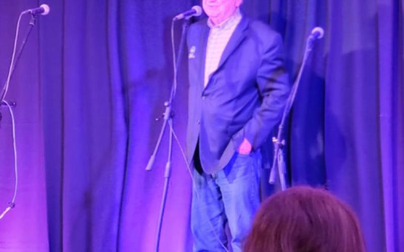Al Harper shared some words at his surprise birthday party with the crowd full of friends, family, and associates. Photo credit Jim Harper