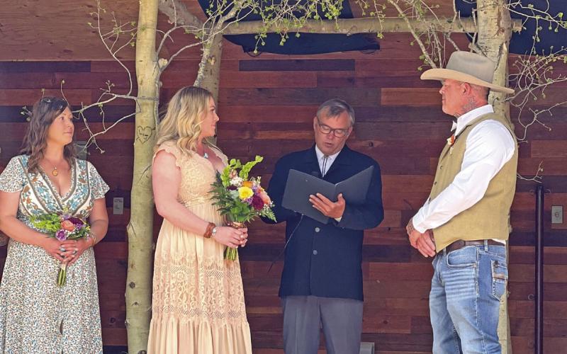 Leah and Jeremy Ham were wed by local judge Anthony Edwards with Corey Ann standing by the bride’s side on the Mike Geryak Stage in Ansei Park. Photo by DeAnne Gallegos