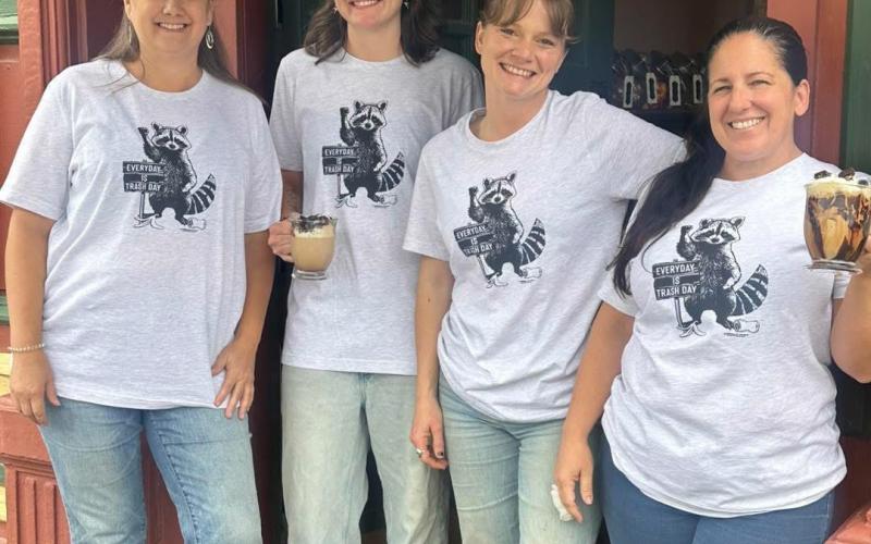 In light of all the “trash drama,” Elevated Coffee Shop in the Grand Imperial Hotel is making a drink out of it. The “Trash Panda” was presented on a social media post by coffee shop owner Melanie Barger on the far left. Timberline Trading Co. across the street designed the t-shirt that is for sale in their shop.