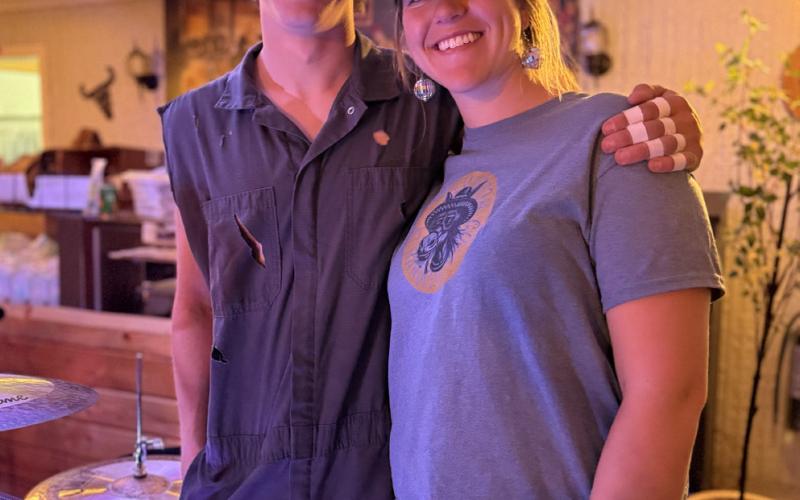 photo by DeAnne Gallegos Local brother and sister Thomas and Sarah Moore enjoyed the break during El Bandito House Band performance which Thomas is the drummer.