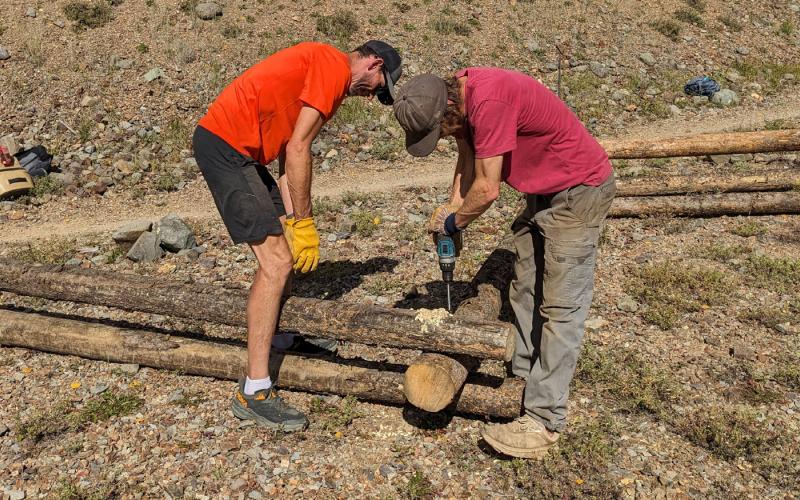 Building a fence on the Baker’s Park trail. Photo credit Silverton Singletrack Society