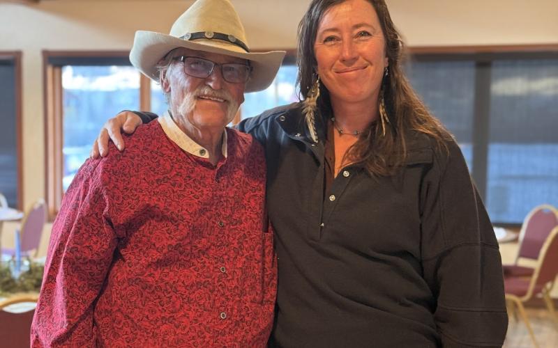 Tommy Wipf and Sara Mordecai enjoyed each other’s company at the Emberglow community feast photo by DeAnne Gallegos