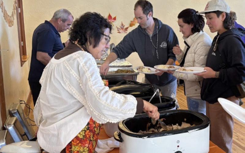 photo by Melanie Bergolc Happy locals enjoyed Thanksgiving luncheon together. Thank you to Fred and Patty for putting on this event