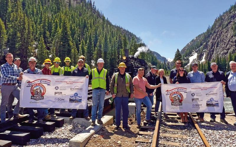 VIP group, Harper Family, DSNGRR leadership and rail crew all celebrate the inaugural steam train over the newly constructed Animas Bridge just south of town. Photo credit DeAnne Gallegos