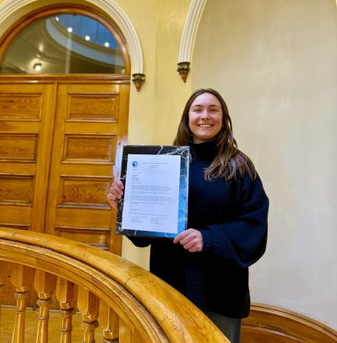 Town of SIlverton's Community Development Director Lucy Mulvihill shows off the letter from the Department of the Interior announcing Town of Silverton's CLG photo by DeAnne Gallegos