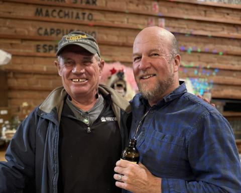 Longtime local Terry Morris and newly appointed Town Councilman Dr. David Brown enjoying live music at The Den photo by DeAnne Gallegos