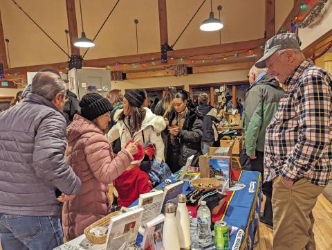 Train Store owner Bob Boeder and shoppers at the annual Mistletoe Market. Photo credit Silverton Creative District