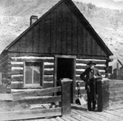 Silverton pioneer Francis Snowden, posed in front of his Silverton cabin, said to the first in town. His family was one of many benefiting from the contents of the Nossaman Archives this past year.