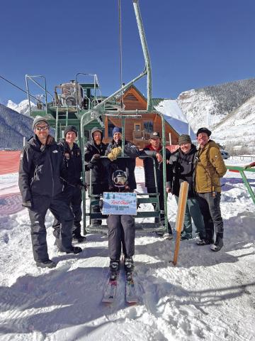Photo credit DeAnne Gallegos Kendall Mountain Ski Area crew on opening day with First Chair of Winter 2024 season rider Jayden Jones.