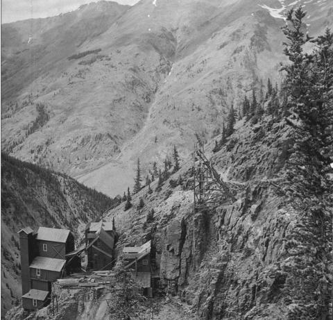 The Old Hundred Mine in 1906, from above and southeast of the improvements. Shows all improvements in place at the height of operations, including boarding house, tram buildings and portal and entry structures. View is from higher on Galena Mountain in a northwesterly direction, toward Brendel Gulch on Macomber Peak San Juan County Historical Society photo