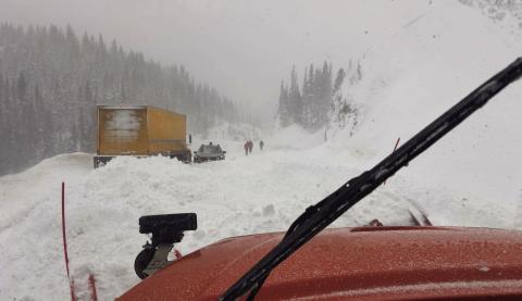 A natural slide occurred, striking one box truck and trapping a smaller vehicle that attempted to drive through the slide. Photo credit CDOT