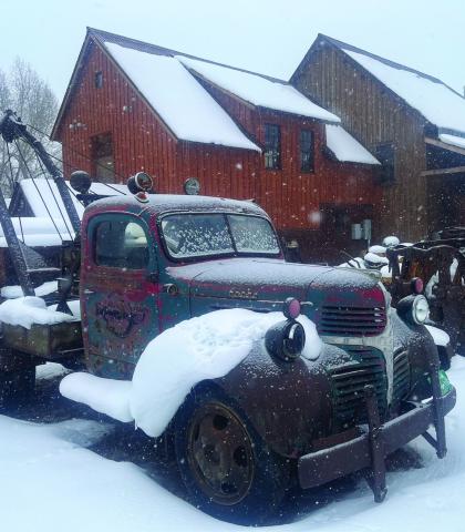 Photo credit Scott Fetchenhier Just a dusting of snow on the antique trucks outside The Mining Heritage Museum.