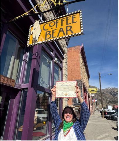 Coffee Bear owner Holly Huebner shows off her YearRounder certificate given to her by SJDA Director Sarah Moore. Photo by SJDA