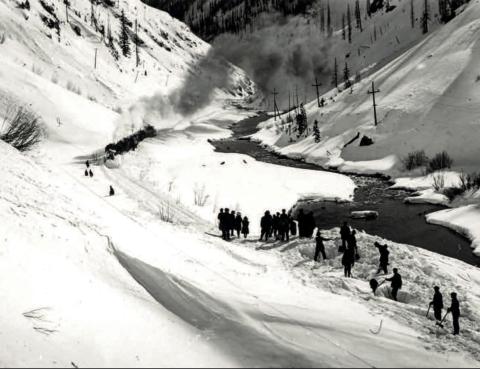 An undated post card of snow clearing on a slide along the Denver and Rio Grande Railroad south of Silverton. Menare hand-shoveling while passengers have walked to make a connection to a south-facing train beyond the slide. Photo courtesy of San Juan County Historical Society