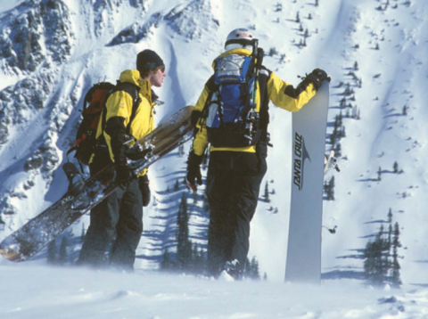 Jen and Aaron Brill 2002 Silverton Mountain. Aaron holding his calling card- a super large snowboard. (photo Scott DW Smith)